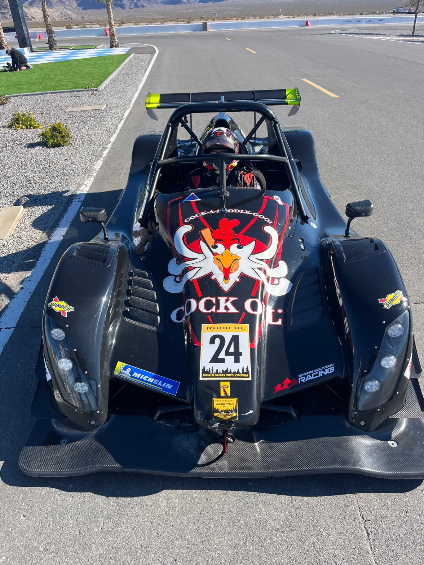 Cock Oil #24 Radical race car on track